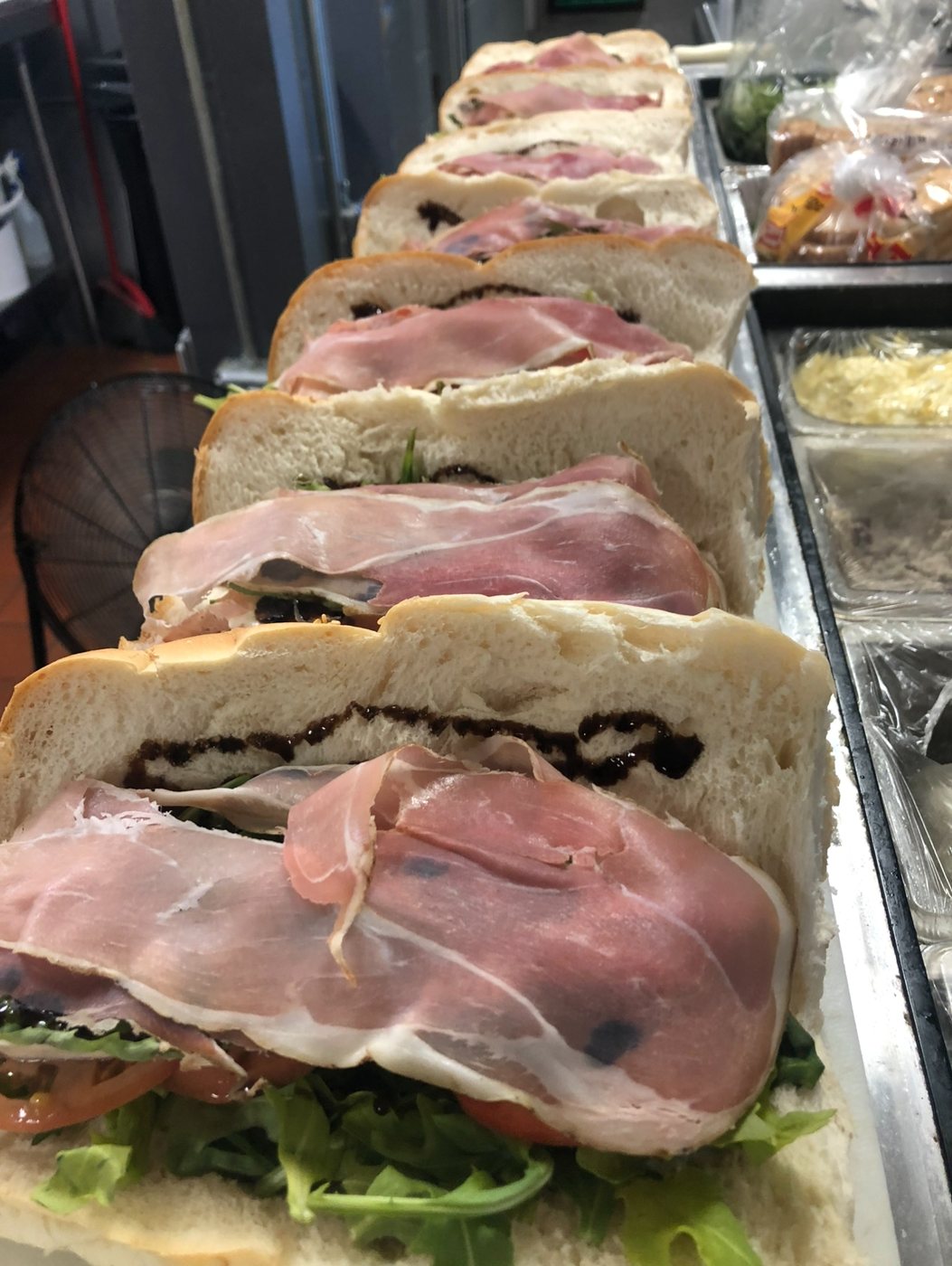 Prosciutto, arugula and tomato sandwiches