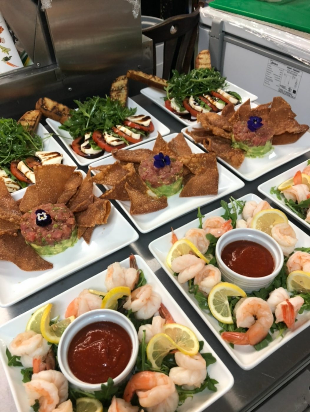 Caprese, tuna tartare and shrimp cocktail plates